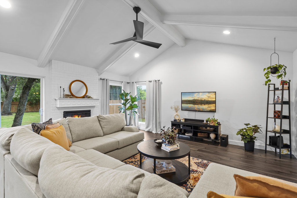 9308 Meadowheath Drive Austin, TX 78729 - Photo 7 of 40 a living room with furniture fireplace and window