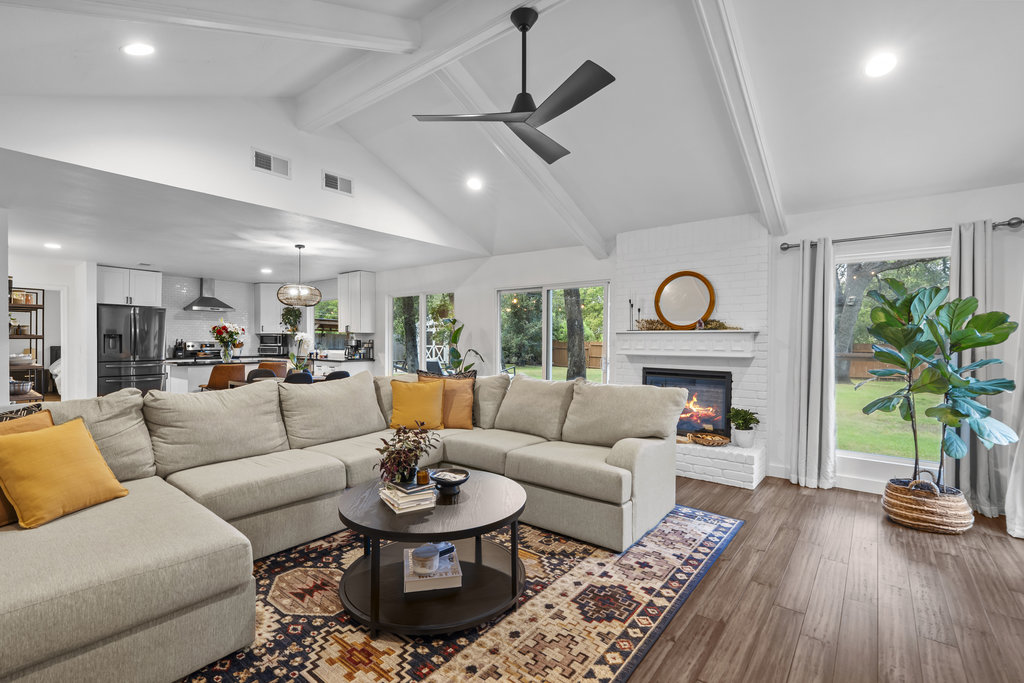9308 Meadowheath Drive Austin, TX 78729 - Photo 9 of 40 a living room with furniture a rug and a large window