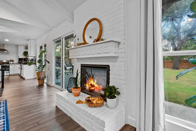 a view of a livingroom with furniture and a fireplace