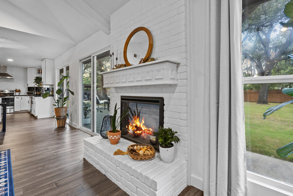 9308 Meadowheath Drive Austin, TX 78729 - Photo 10 of 40 a view of a livingroom with furniture and a fireplace