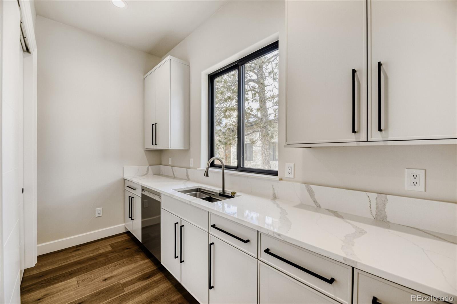 5796 Powell Road Parker, CO 80134 - Photo 17 of 50 a kitchen with a sink and a window