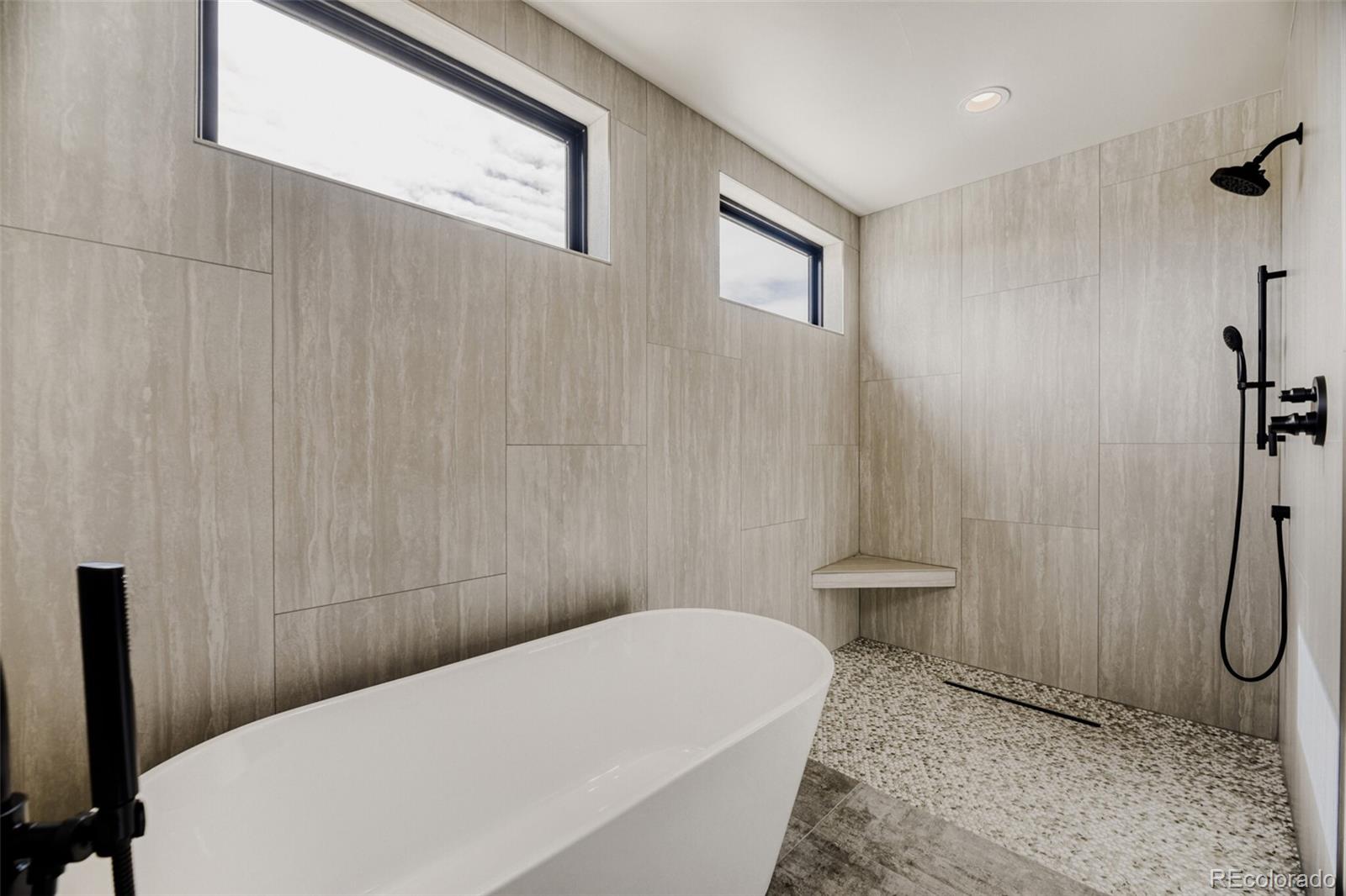 5796 Powell Road Parker, CO 80134 - Photo 27 of 50 a bathroom with a sink a toilet and shower