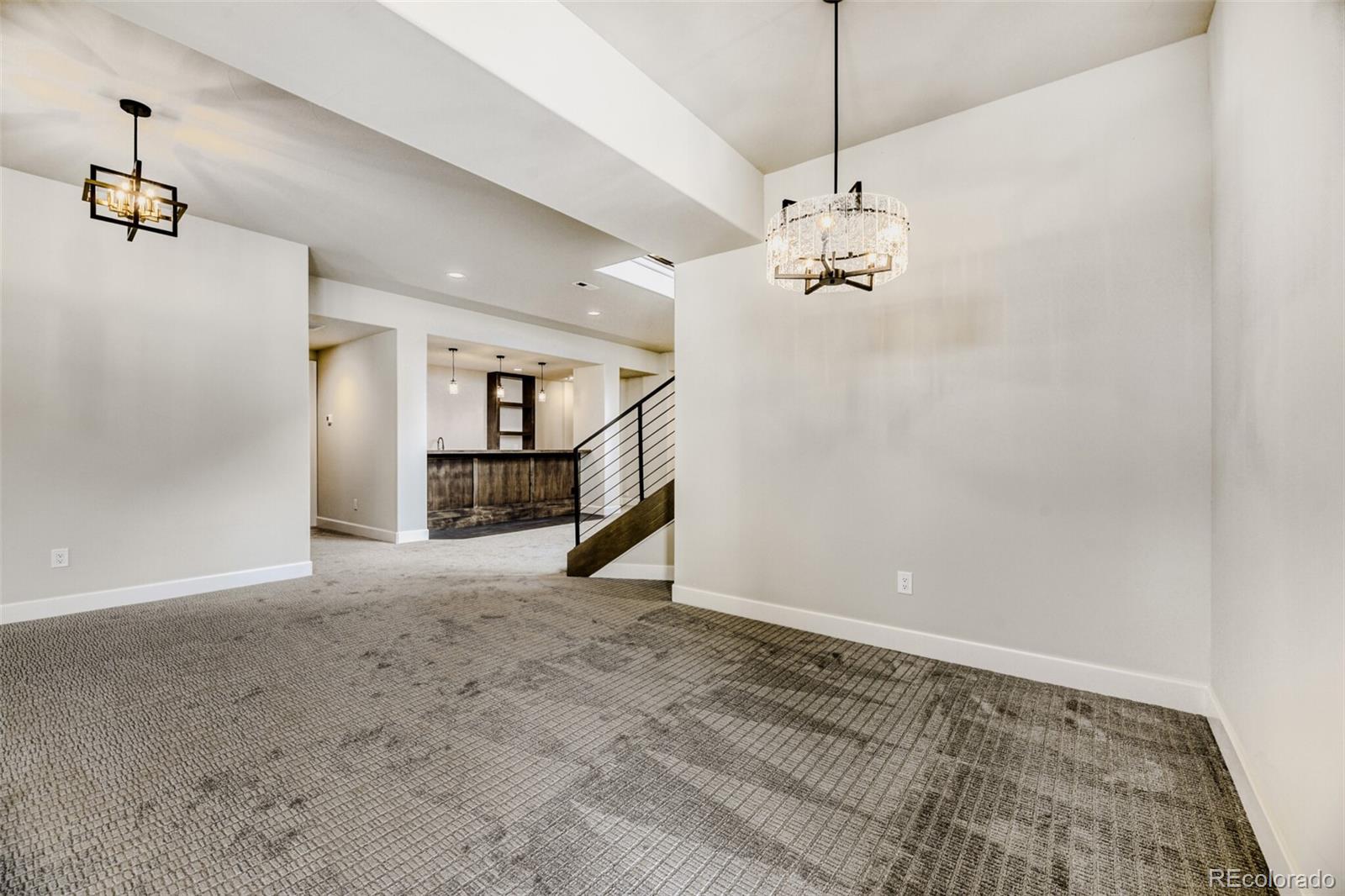 5796 Powell Road Parker, CO 80134 - Photo 32 of 50 a view of a kitchen with a sink and a chandelier
