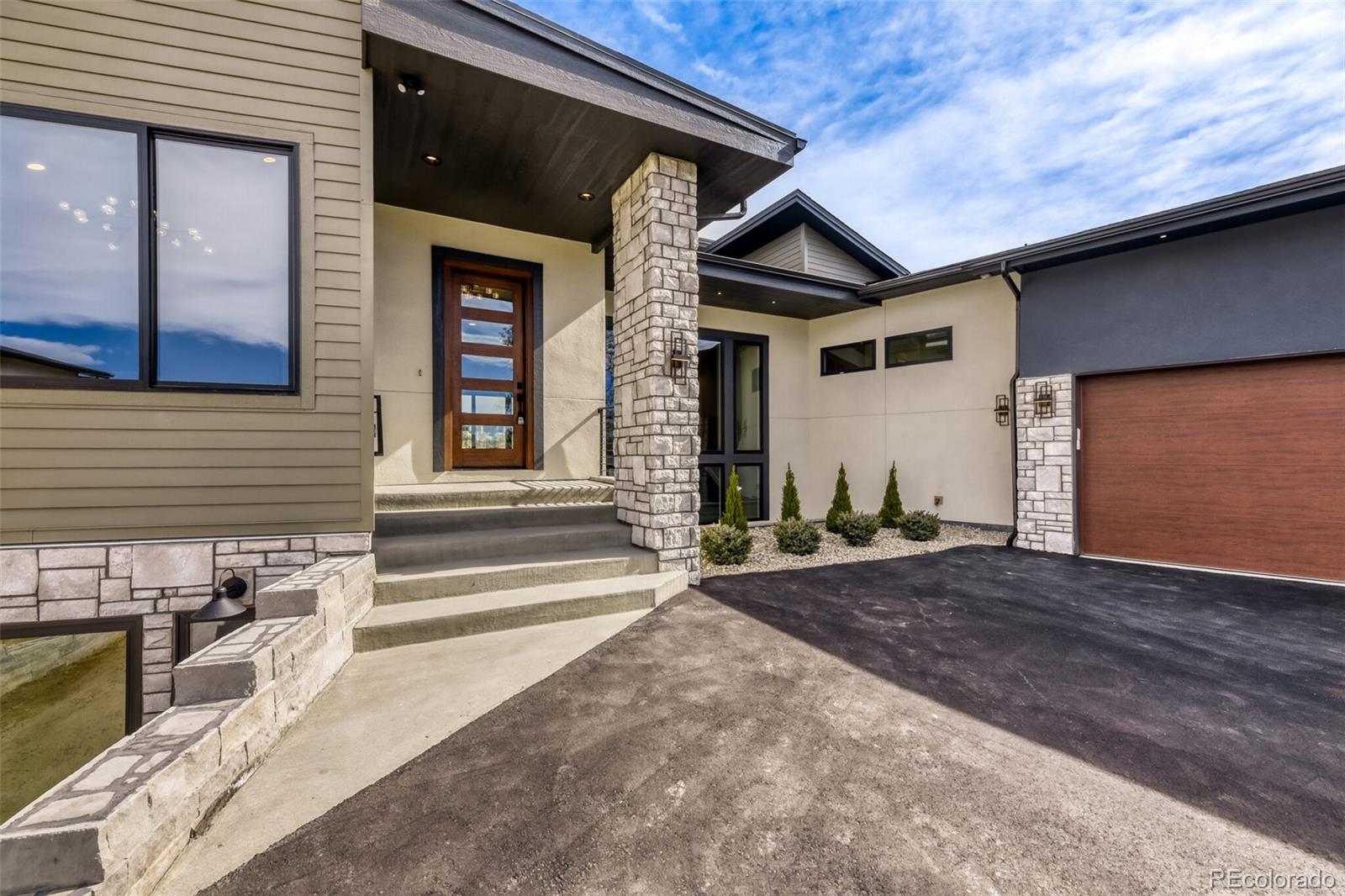 5796 Powell Road Parker, CO 80134 - Photo 4 of 50 a front view of a house with a yard