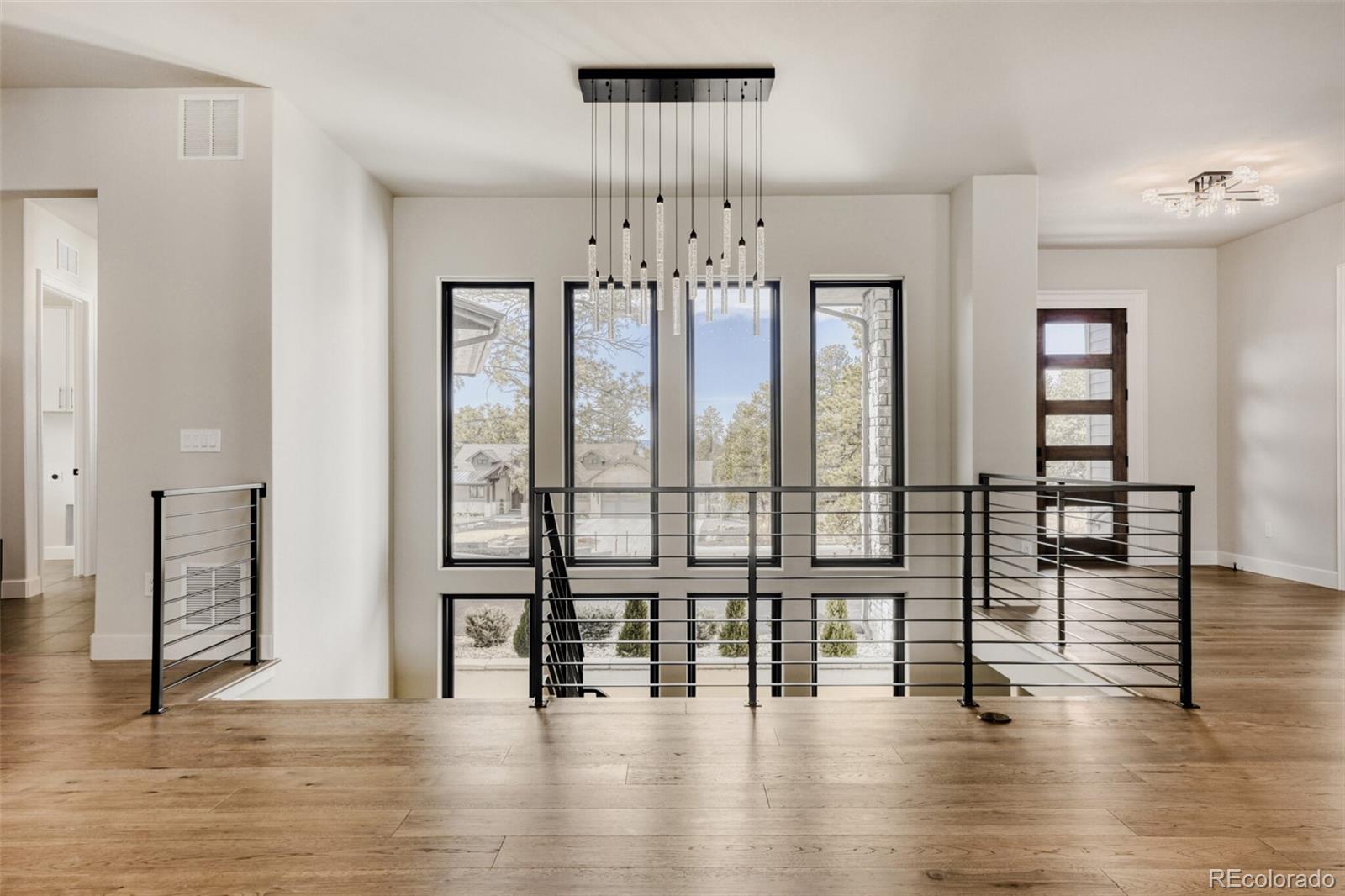5796 Powell Road Parker, CO 80134 - Photo 8 of 50 a view of an entryway with wooden floor