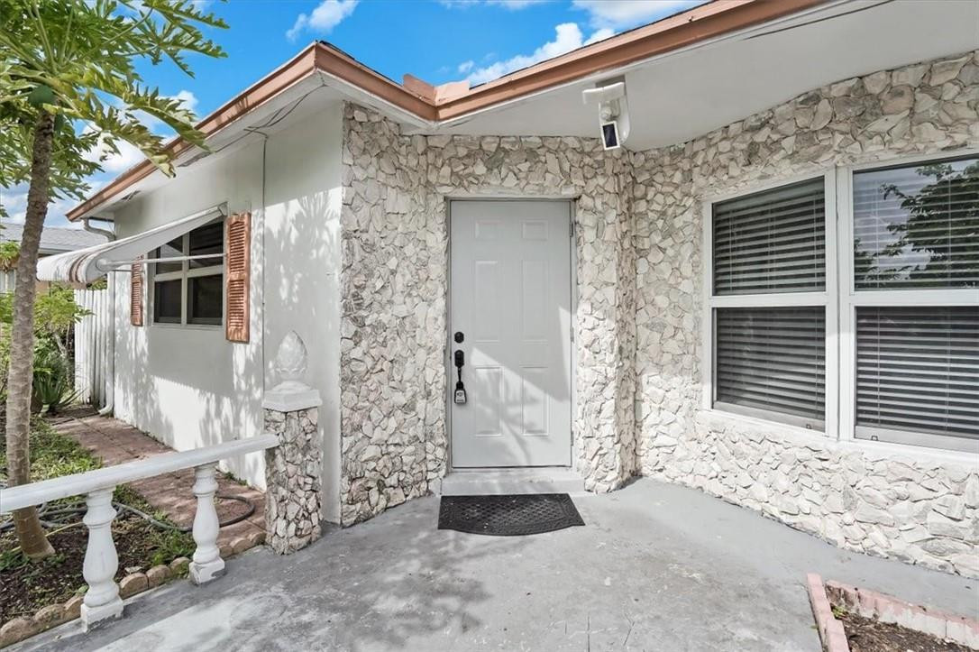 830 Southwest 50th Avenue Margate, FL 33068 - Photo 1 of 30 a front view of a house with garage