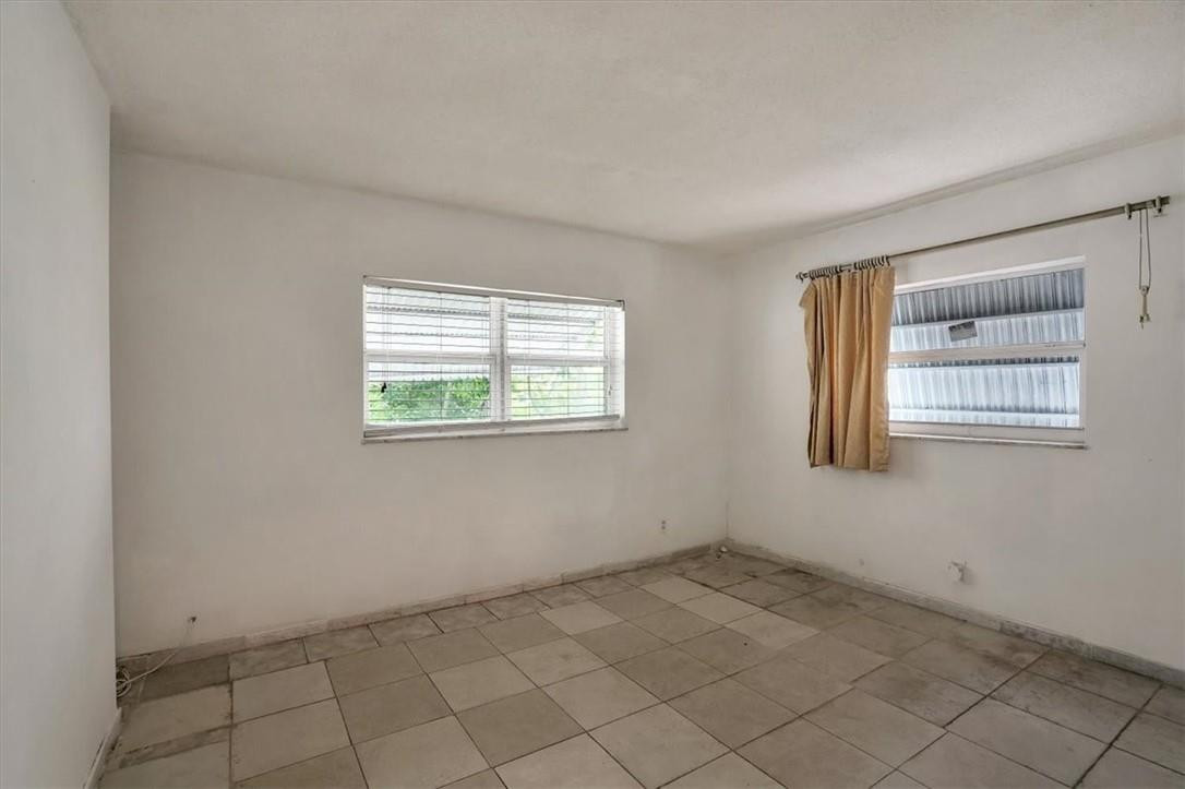 830 Southwest 50th Avenue Margate, FL 33068 - Photo 19 of 30 an empty room with windows