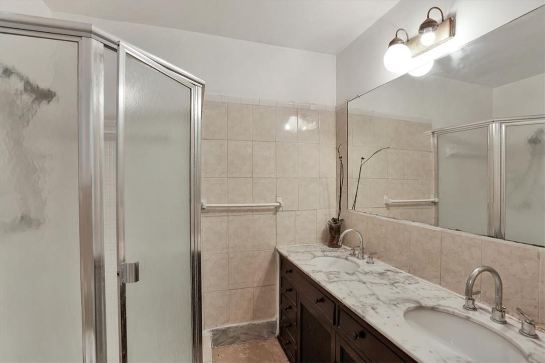 830 Southwest 50th Avenue Margate, FL 33068 - Photo 25 of 30 a bathroom with a granite countertop sink mirror and double