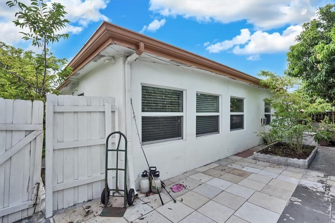 830 Southwest 50th Avenue Margate, FL 33068 - Photo 27 of 30 a front view of a house with garden