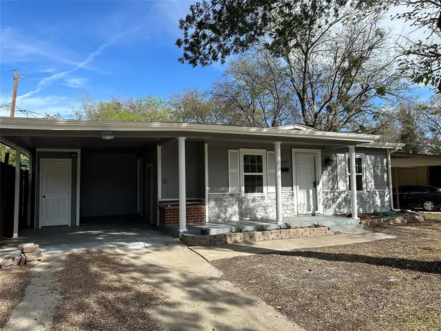 a front view of a house with a patio