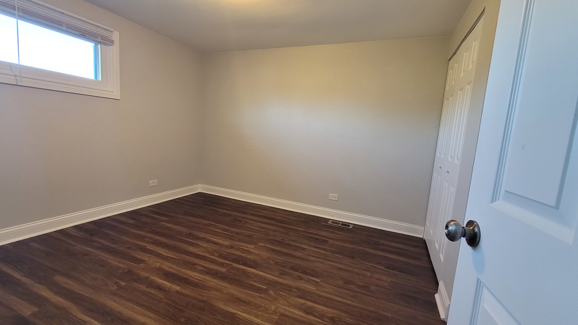 120 Cotuit Court, Unit 120 Schaumburg, IL 60193 - Photo 13 of 17 wooden floor in an empty room