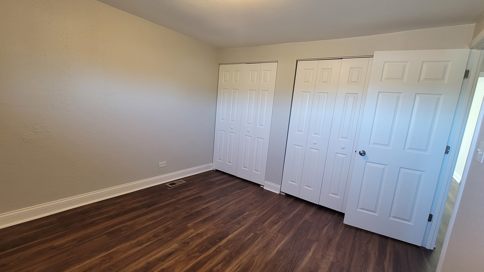 120 Cotuit Court, Unit 120 Schaumburg, IL 60193 - Photo 14 of 17 a view of an empty room with wooden floor