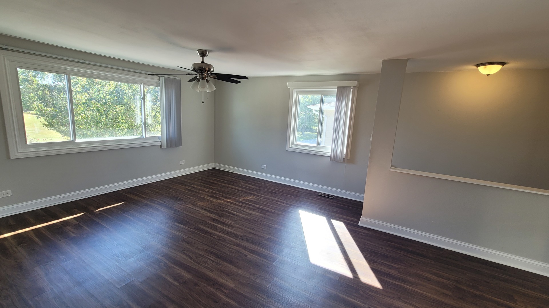 120 Cotuit Court, Unit 120 Schaumburg, IL 60193 - Photo 3 of 17 a view of empty room with wooden floor and fan