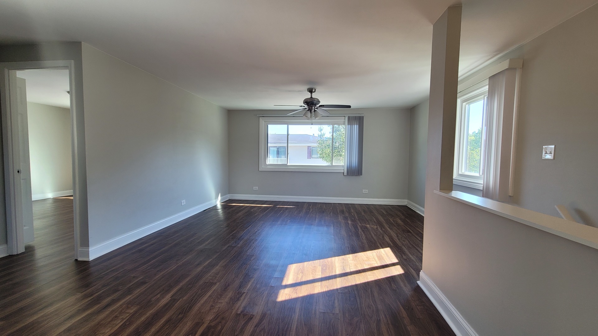 120 Cotuit Court, Unit 120 Schaumburg, IL 60193 - Photo 4 of 17 an empty room with wooden floor and windows