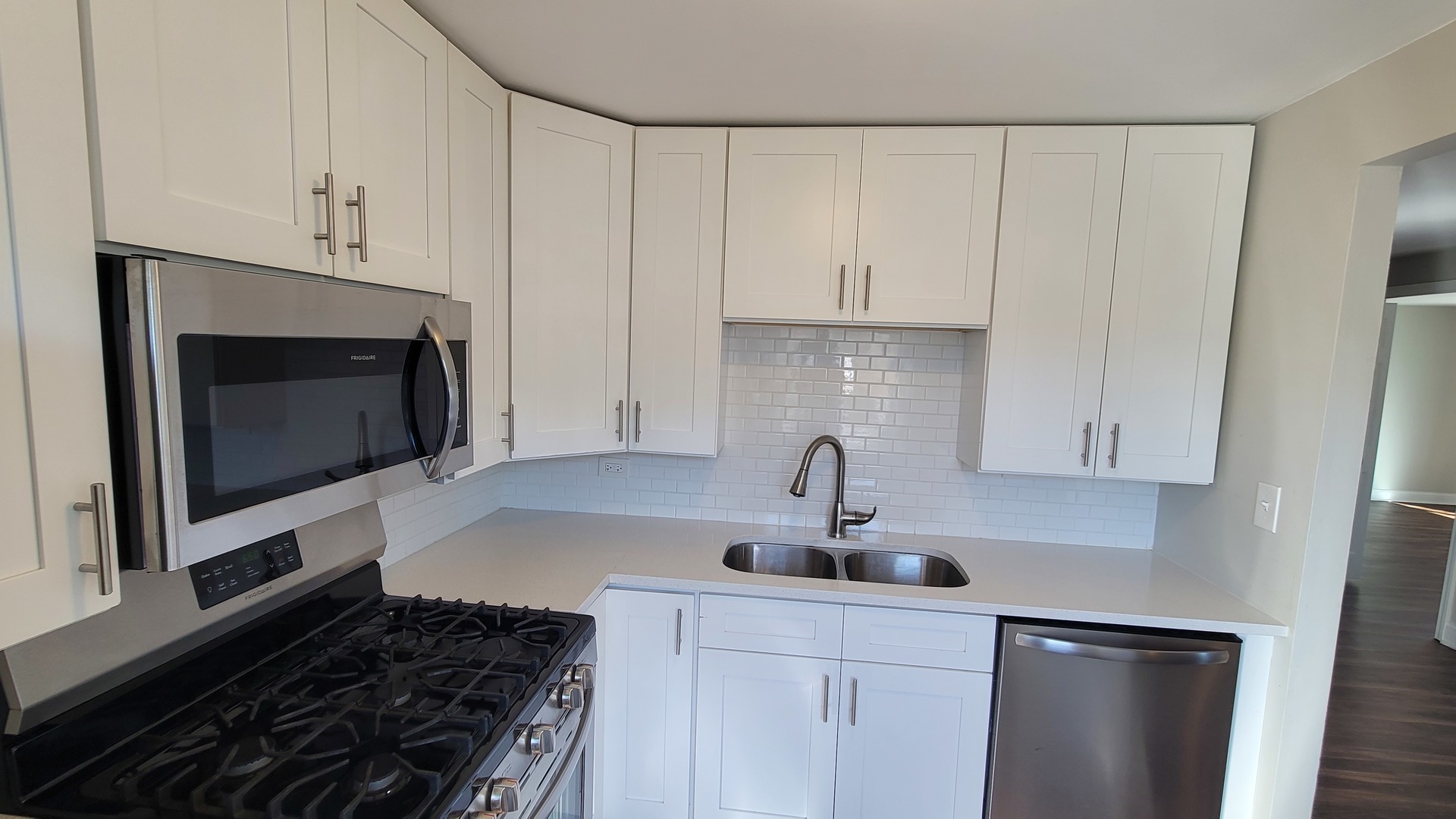 120 Cotuit Court, Unit 120 Schaumburg, IL 60193 - Photo 10 of 17 a kitchen with white cabinets and appliances