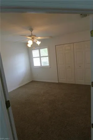 a view of a room with large windows