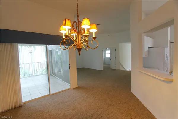 a kitchen with stainless steel appliances a sink a stove a refrigerator and cabinets