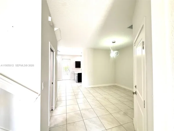 a view of a bathroom with a shower and a sink