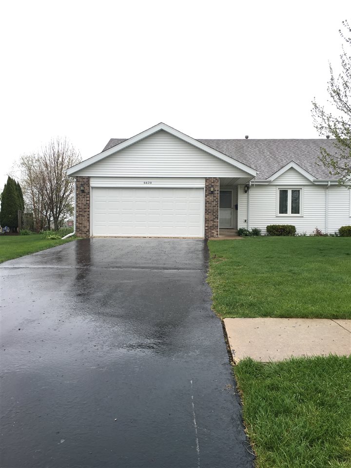 6620 North Point Road, Unit 2 Rockford, IL 61108 - Photo 1 of 21 a front view of house with yard and green space