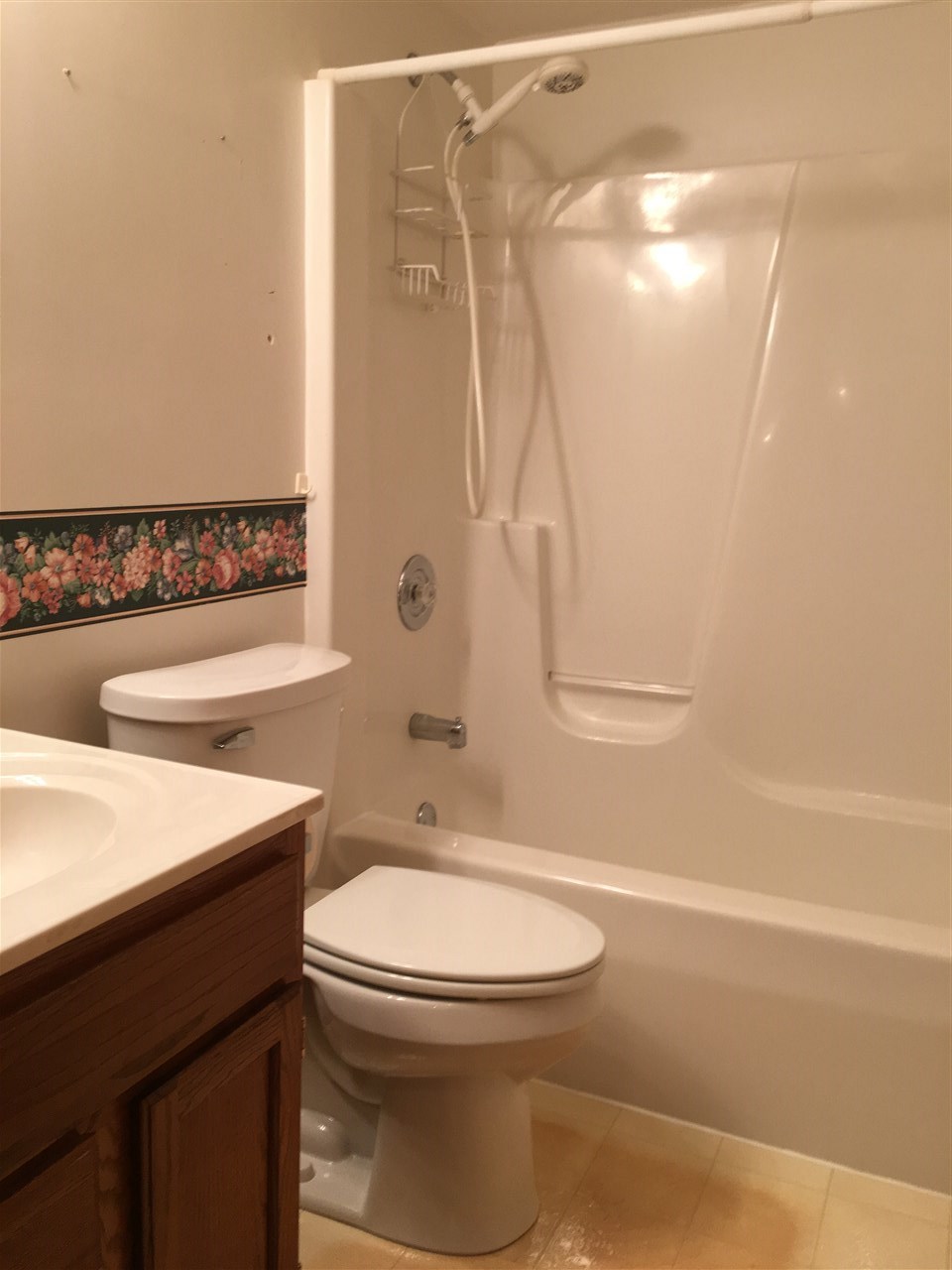 6620 North Point Road, Unit 2 Rockford, IL 61108 - Photo 8 of 21 a bathroom with a sink a toilet and shower