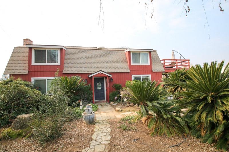 8053 South Rio Avenue Reedley, CA 93654 - Photo 1 of 30 a house with lots of trees