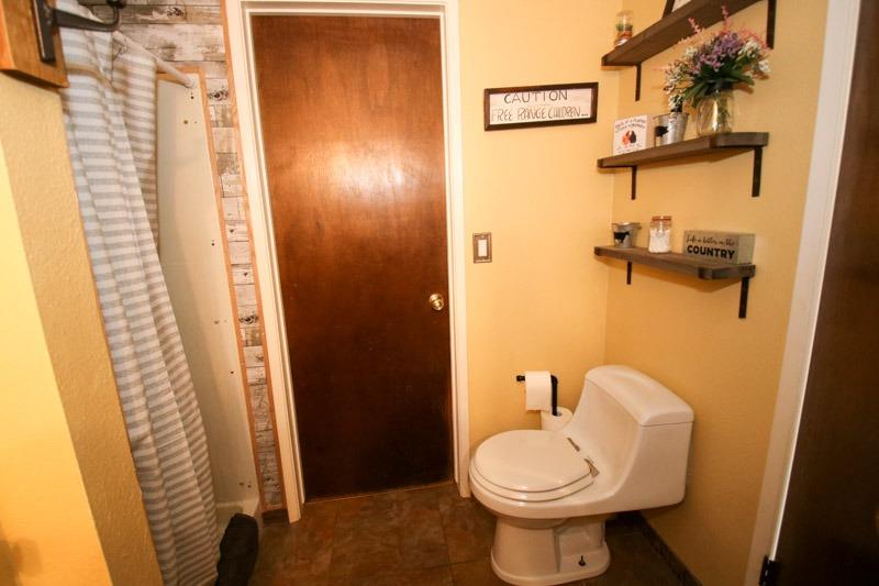 8053 South Rio Avenue Reedley, CA 93654 - Photo 11 of 30 a bathroom with a sink and toilet