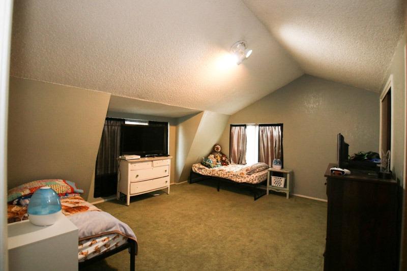8053 South Rio Avenue Reedley, CA 93654 - Photo 19 of 30 a living room with furniture and a flat screen tv