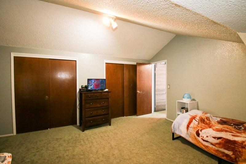 8053 South Rio Avenue Reedley, CA 93654 - Photo 20 of 30 a bedroom with a bed and furniture