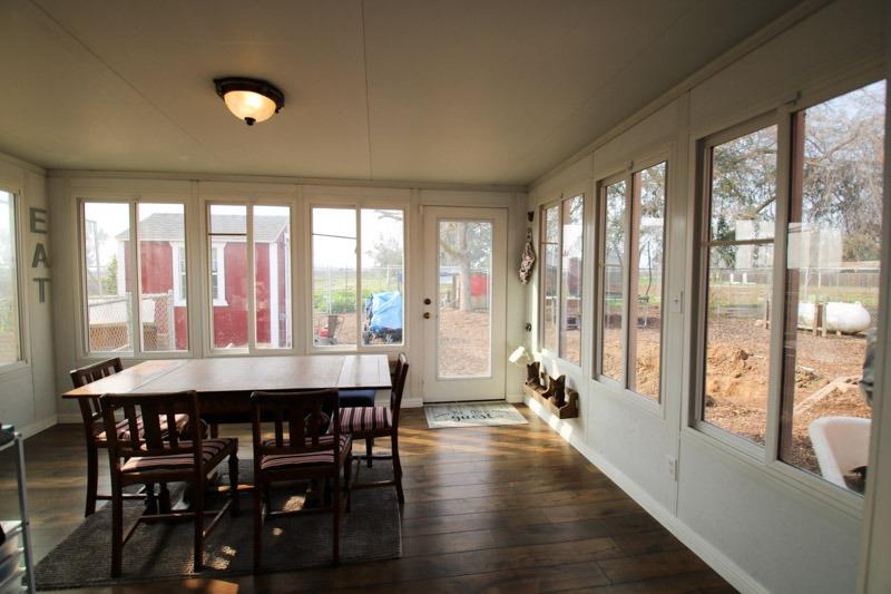 8053 South Rio Avenue Reedley, CA 93654 - Photo 22 of 30 a dining room with furniture window wooden floor