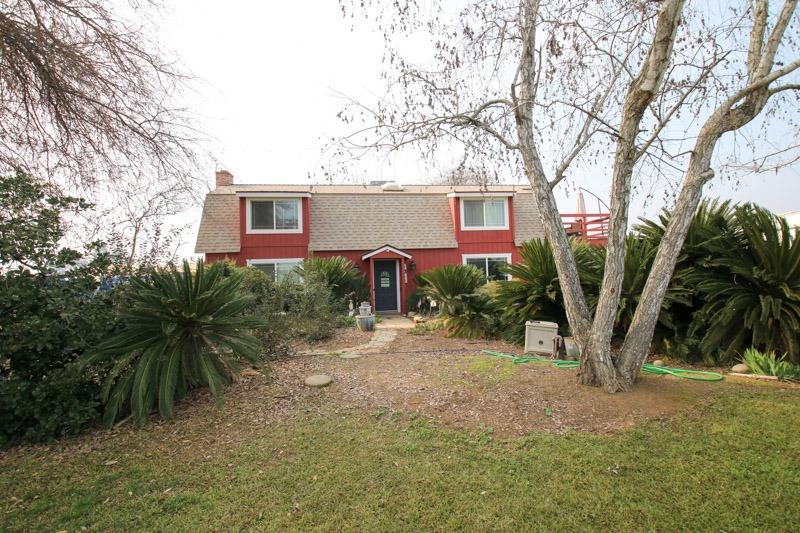 8053 South Rio Avenue Reedley, CA 93654 - Photo 4 of 30 a front view of a house with garden