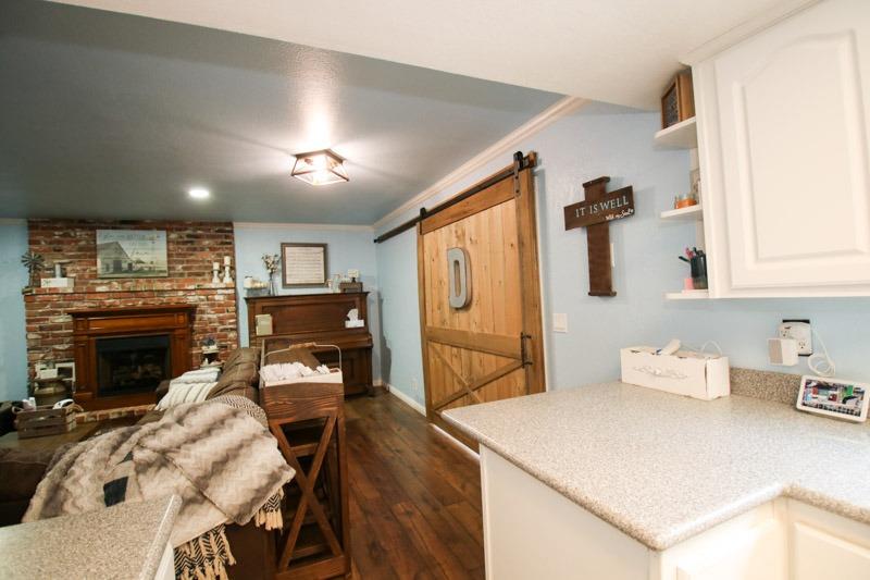 8053 South Rio Avenue Reedley, CA 93654 - Photo 7 of 30 a bedroom with furniture and a fireplace
