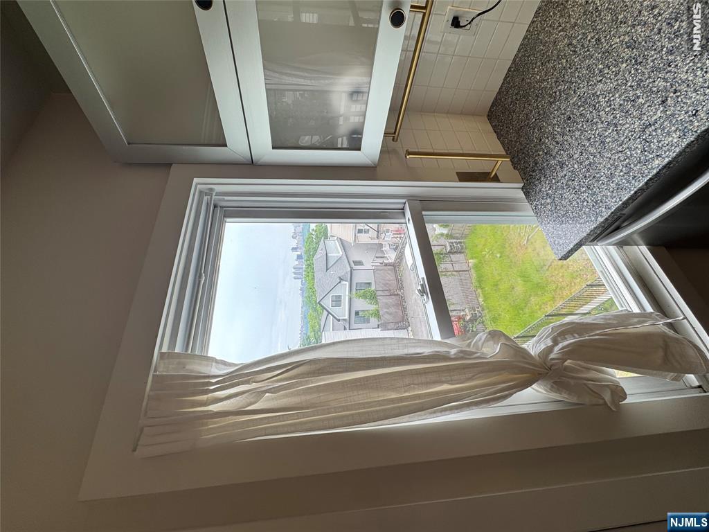 21 Valley Place, Unit 3 Edgewater, NJ 07020 - Photo 13 of 18 a view of a living room and a window