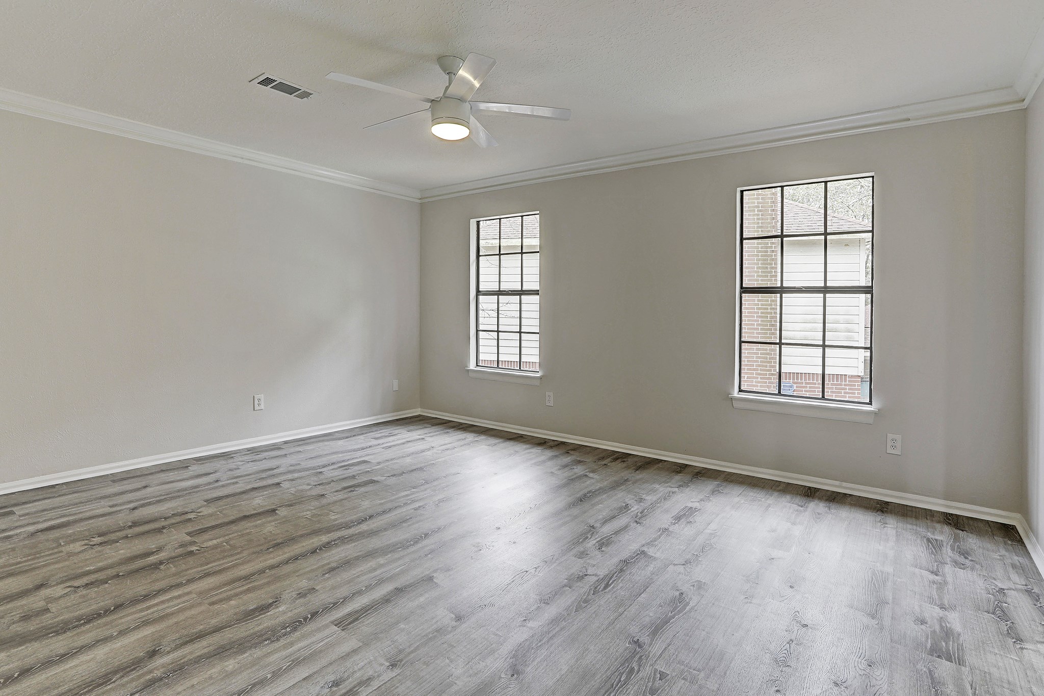 2 Eagle Rock Place Spring, TX 77381 - Photo 9 of 16 The primary bedroom is spacious and features engineered hardwood flooring.