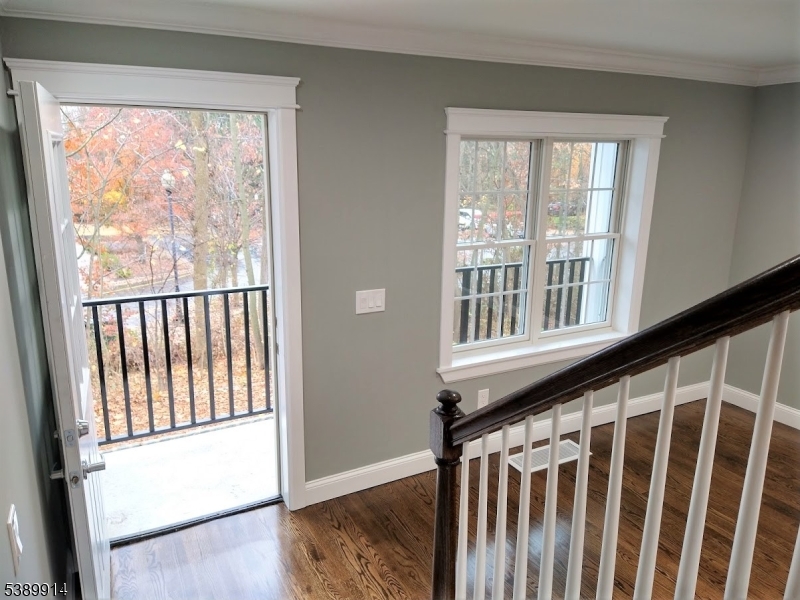 34 Walnut Street Madison, NJ 07940 - Photo 12 of 18 a view of a porch with wooden floor and a window