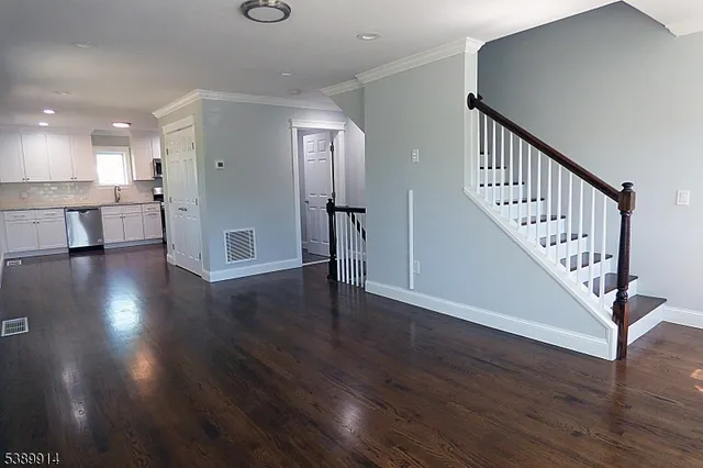 a view of an entryway with wooden floor