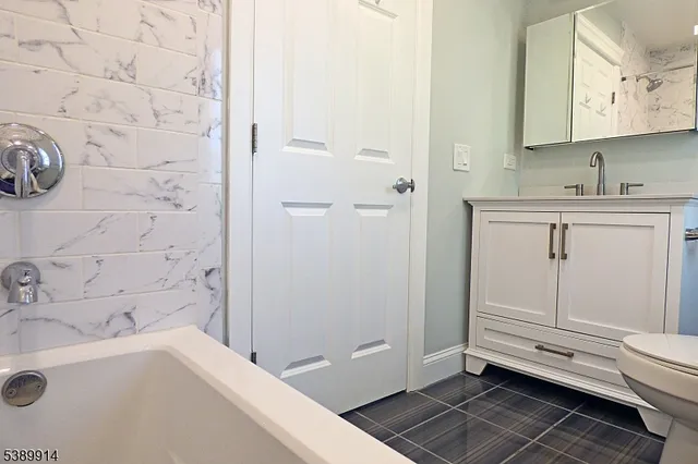 a bathroom with a sink and a tub