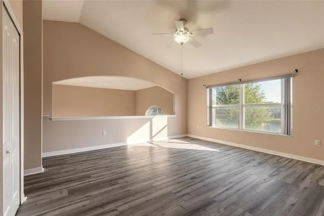 a view of hallway with wooden floor