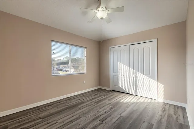 a view of a hallway with windows and stairs