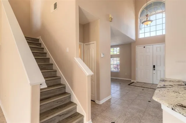 a view of a kitchen with a sink and a refrigerator
