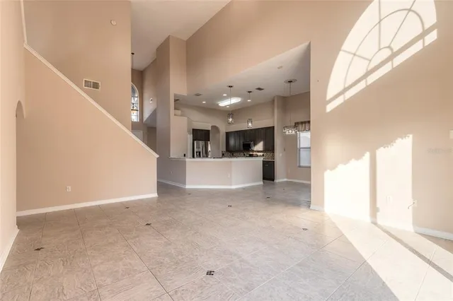 an aerial view of residential houses with outdoor space and river