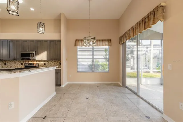 an aerial view of a house with a lake view