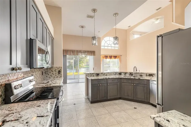 an aerial view of a house with a lake view