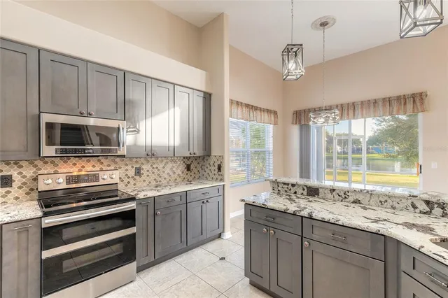 a view of house with yard and entertaining space