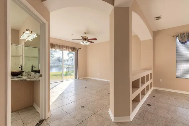 a bathroom with a granite countertop toilet a sink and bathtub