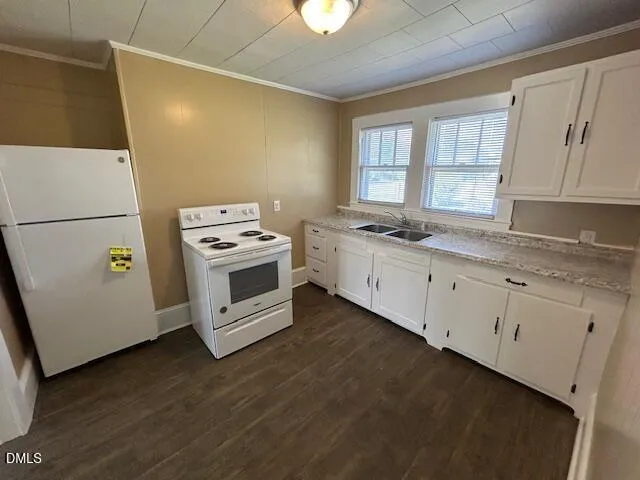 a kitchen with appliances and cabinets