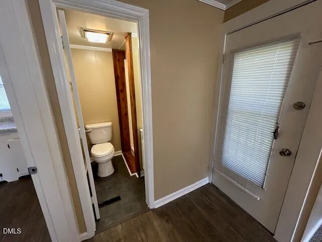 a view of a bathroom from a door