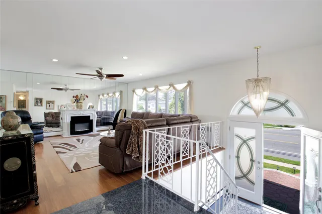 a view of livingroom with furniture fireplace and windows