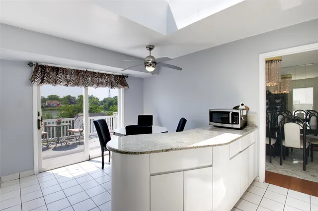 a kitchen with a stove a sink and a refrigerator