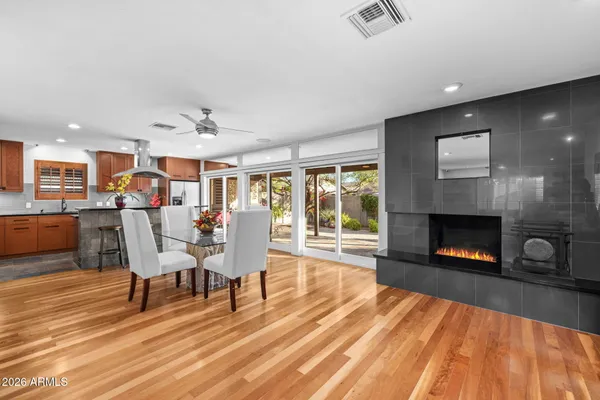 a spacious bedroom with a bed and a cabinets