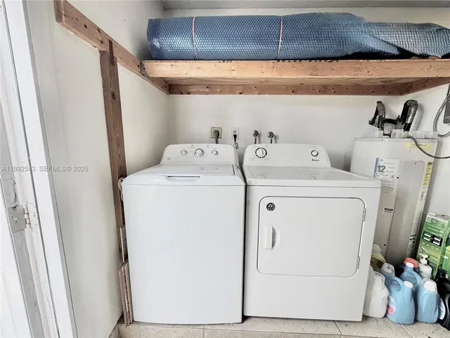 a utility room with dryer and washer